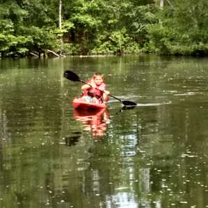 Our first time on kayaks! It was the perfect place to learn. We played Catch on the pond and had a great time.