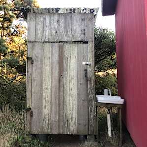 Outhouse by the red cabin