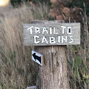 Sign at the parking area, directing you to the cabins. There is a wagon there to cart your stuff in.