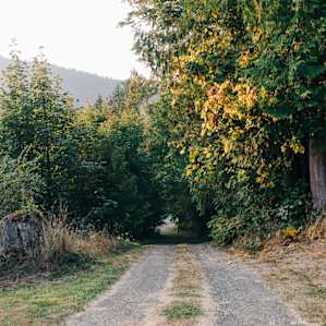 The gravel road that leads back out to the highway.