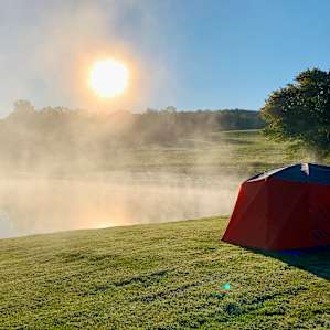 Views of woods, pond, and sunrise
