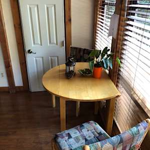 Little table and door to the bathroom