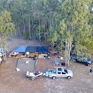 Our campsite, plenty of room and great facilities (including a fire pit, table, and bins)
