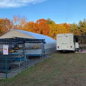Greenhouse and sitting area during the day.