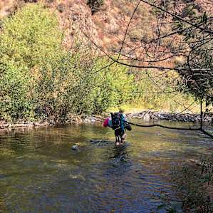 Cross the river to leave the campsite
