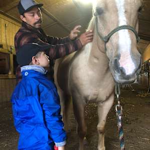 Pedro teaching my son about how to safely approach a horse
