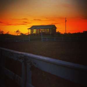 Sun setting over the bath and shower house