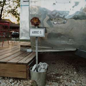 Annie O. is one of several campers within the Off the Vine RV park intended for guests to visit. Each is labeled and given a driveway as well as plenty of individual space.