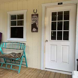 The front porch of the cabin, with Boots the kitty, who was a frequent visitor and even came inside a few times to sleep on the bed! We left the three windows open at night and there was a wonderful cross breeze.