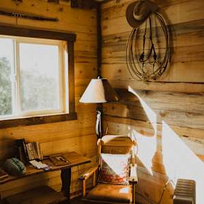 Inside the bunkhouse, with the light pouring in as the space heater warmed our bones.