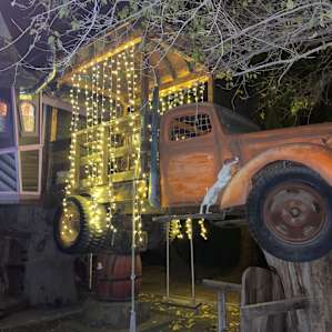 The treehouse at night with pretty fairy lights!