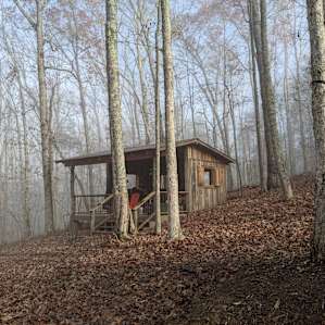 The shelter is bigger than it looks. There is also a way to enclose the front with tarps if weather gets tough. Plenty of space for food prep.