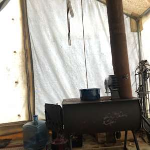 Tent had dropped to about 20 overnight, so I jumped out of bed, started up the fire, and got back into the sleeping bag til it warmed up.