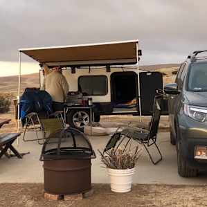 Terri provided the picnic table, picnic bench, 2 chairs, sun umbrella, fire pit with cover. Although, it was too windy to use and there is a fire ban in the area.