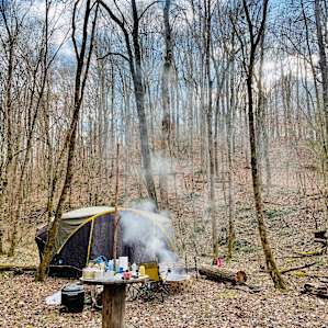 Washing dishes by the creek
