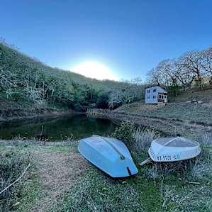 The pond is just a few steps up a short ridge above the camp. Water looks very low because of the drought.