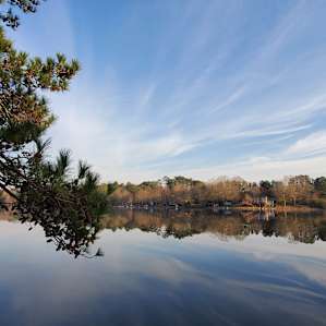 Beautiful view of the 50+ acre lake from our site. The camp only allows trolling motors on the fishing boats, keeping it quiet for us and safe for the kayakers.
