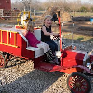 How adorable is his tiny little fire engine. My girls loved ringing the bell and honking the horn.