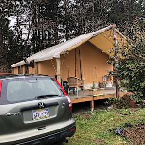 My car parked next to the tent