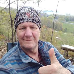 Me sitting at top of hill tent camp site