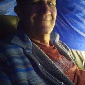 Me inside tent at night