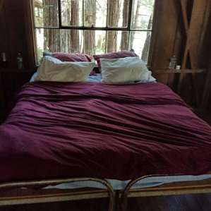 Home away from home. Having camped at the Woodlands for years, I have learned to bring a queen size mattress pad and sheet to make our cabin home.