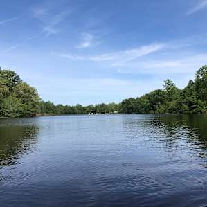 Bakers pond during a spring day from the opposite side of the lake.