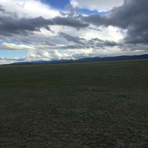 Bighorn Mt Range from the pasture. Big (not by Wyoming standards apparently!) wind storm hit at 1:30am, so be prepared for wind, rain and mud.