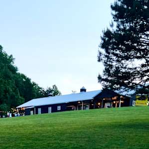 There is a barn stable which is converted into an outdoor hall on property.
