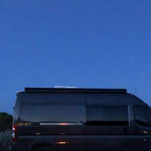 At dusk, looking from campfire-side back towards the front of the property and the road - even with no van in the way, there's no signs of civilization in sight.