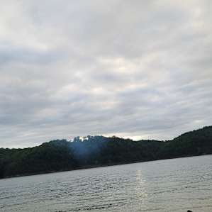 The lake is a rough walk from either trail.