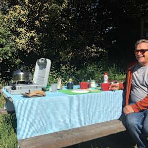 Sunny morning at the picnic table outside the cabin