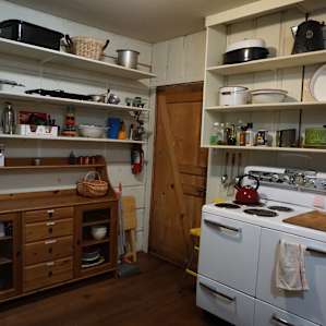 Bowls, plates, mugs, pots, pans, utensils, and more are all there. Even paper towels and aluminum foil!