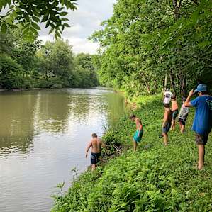 Walking up from camp to wade back down river