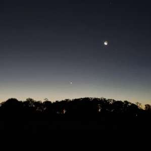 Sleeping under the stars and moon so bright in the sky