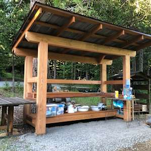 Very clean and organized camp kitchen with everything(and more) you could possibly need. There are also several water jugs with pumps here, at the cabin, and by the fire pit.