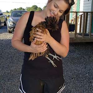 Holding a Polish chicken