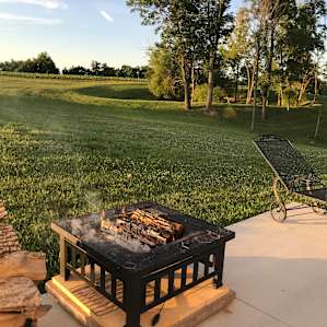Great patio, fire pit, and covered porch overlooking the property.