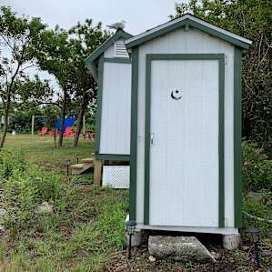 Outhouse (composting toilet) and shed.