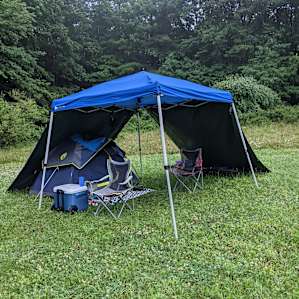 Our setup with a canopy, tarps, and tent.