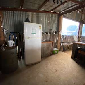 Communal kitchen with fridge, sink and bench space. Kettle too!