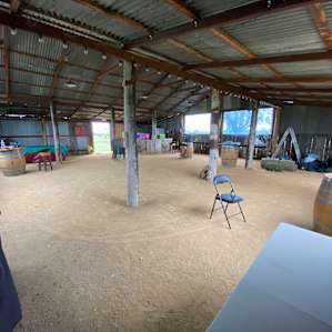 Inside the barn with plenty of room to get out of the weather, sit around the high tables and cook on the BBQ.