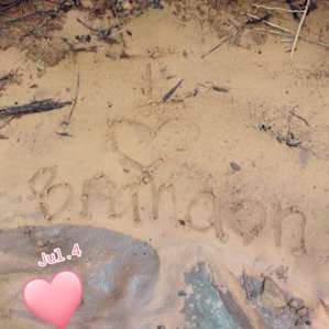 Doodling in the sand in the creek, my love for Brandon ❤️