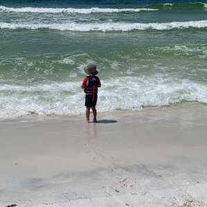 Playing at the nearby beach