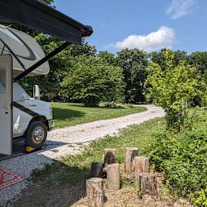 This gravel driveway is for 2 large RV sites. I was the site closest to the lake, front tires were 5-6" lower than back tires, so I used leveling blocks. The site ahead of me I believe is more level.