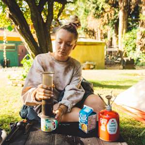 Making morning coffee in camp.