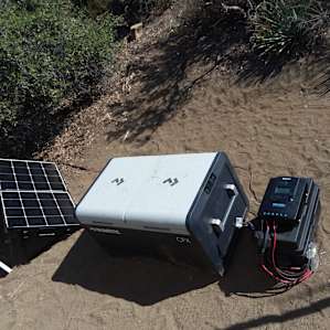 Dometic fridge/freezer setup with 100ah battery and 100w solar panel. Not enough watts to keep battery fully charged in 95 degree weather and with multiple campers opening the fridge frequently.