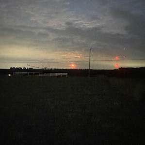 Red moon setting across the street