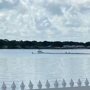 Lake with boat and water skiing