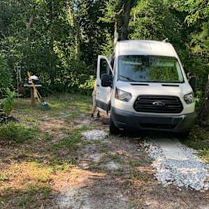 Parking spot. Neighbors are to the right just out of the picture. The back of the van is facing the host’s backyard. The van is facing the street. And the neighbors across the street.